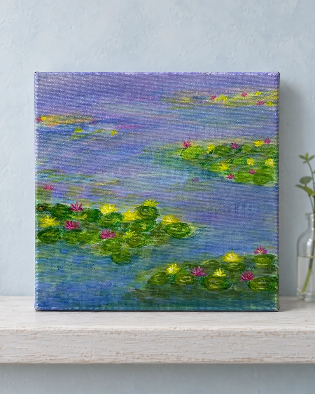 Lily Pond, Morning: an impressionist painting of water lilies drifting on a lavender-blue pond, resting on a pale ledge against a mist-blue wall.