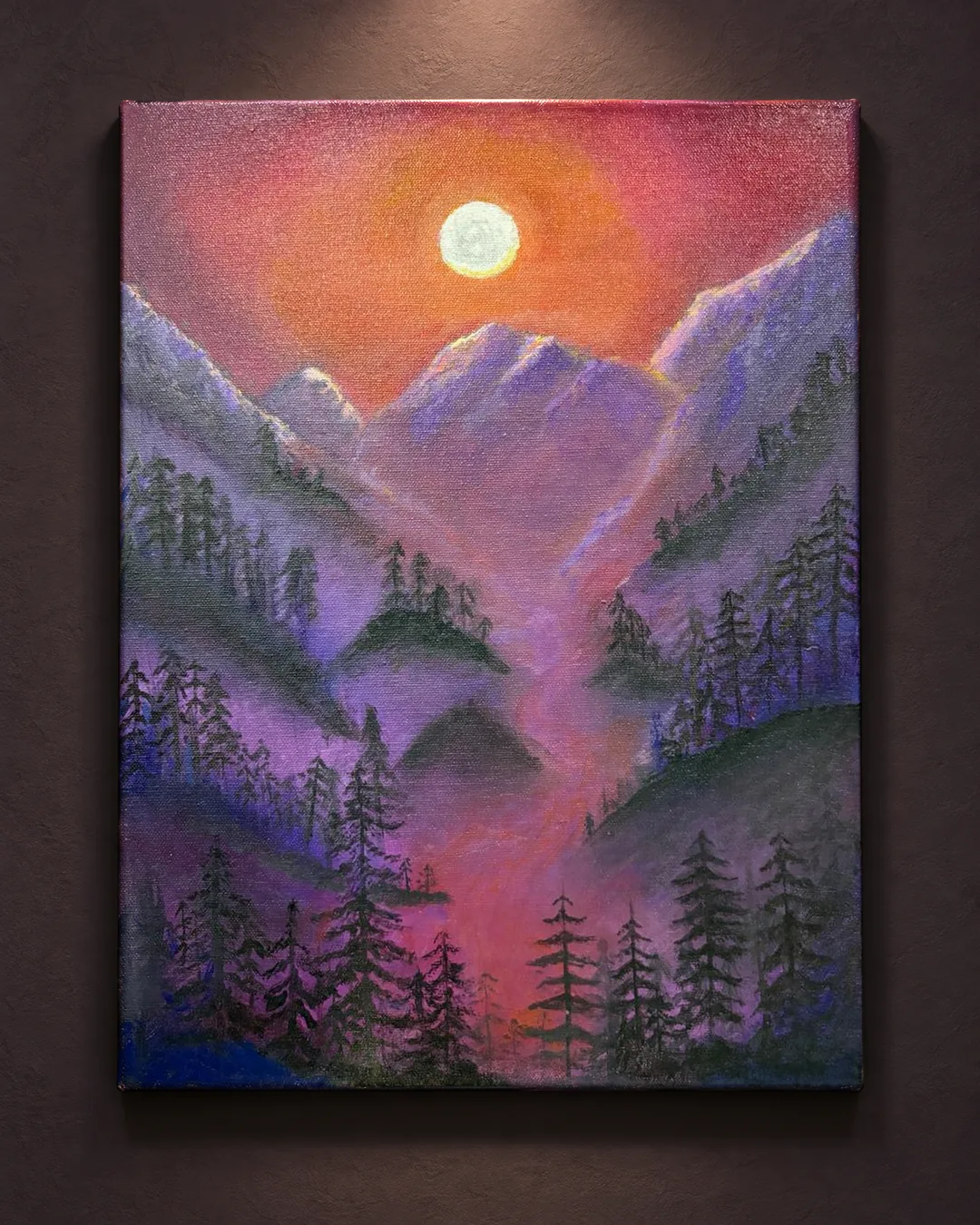 Violet Valley, Moonrise: a portrait-format painting of misty violet mountains and pine forests under a pale moon in an orange sky, lit by a single spotlight on a dark plum wall.
